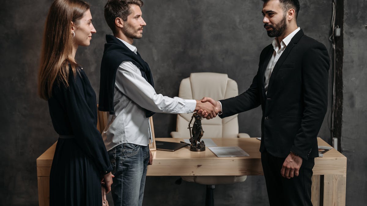 Business professionals shaking hands in a meeting